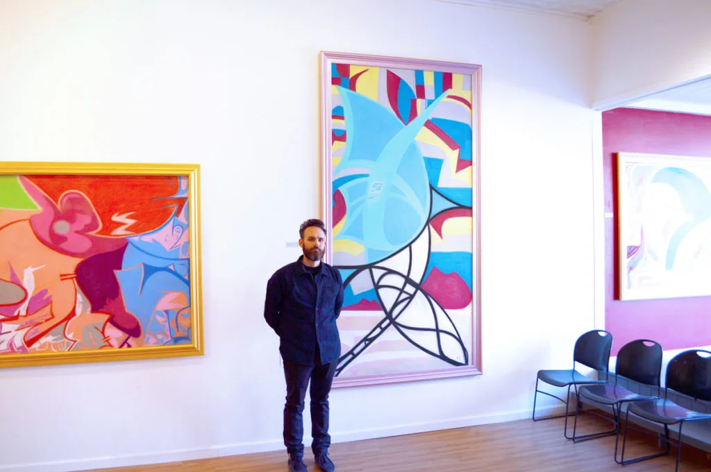 Ian with Painting in Gallery
