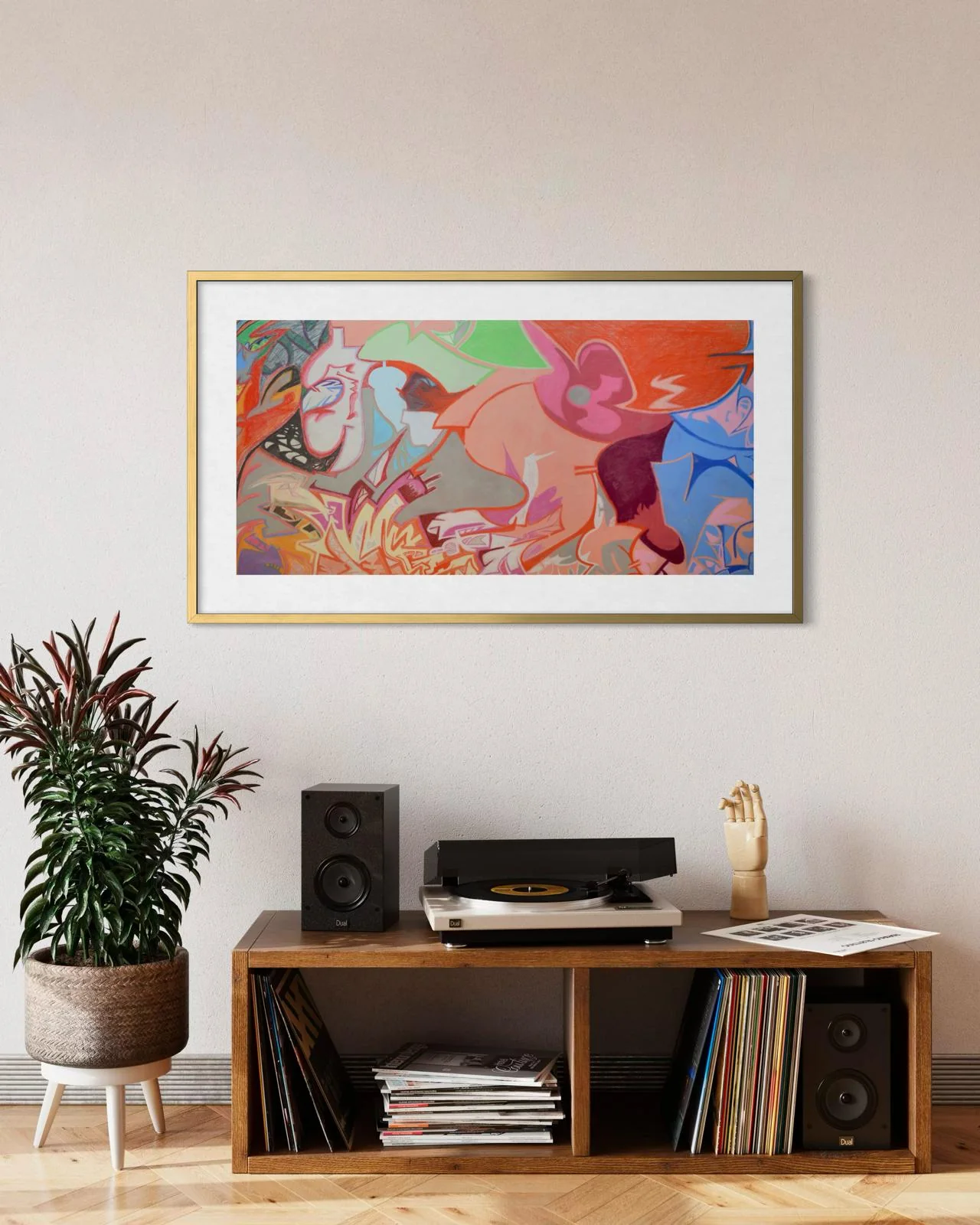 Birth of a Superhero, a framed limited edition print of an abstract pastel by Ian James Roche, hanging above a record player